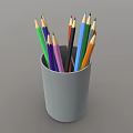Set of Vibrant Colored Pencils Placed in a Gray Cup Holder