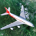 Red and White Passenger Plane Flying Over Mountainous Landscape With Blue Sky and Green Vegetation