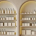 Elegant Arched Shelves Displaying Aromatherapy Diffusers Bottles And Decorative Boxes