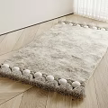 Gray Shaggy Square Rug With Pom Pom Trim On Wooden Floor In Light Room