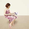 Little Girl In Pink Dress And Sandals Sitting On Floor Reading Open Book