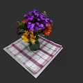 Colorful Flower Bouquet With Purple Yellow Orange Blooms In Vase On Checkered Napkin
