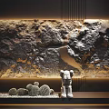 Rocky Textured Background Wall In Golden Gray Tones With White Sculpture And Cactus Decorations