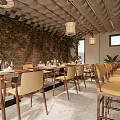 Cozy Restaurant Interior With Brick Wall Green Plants Pendant Lights Dining Tables And Chairs