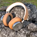 Tan and White Over Ear Headphones with Premium Design on Natural Rocks
