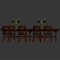 Oval Wooden Dining Table With Eight Wooden Chairs And Green Candlesticks