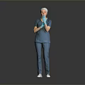 Woman in blue scrubs white cap and blue gloves with hands crossed against gray background