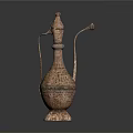 Intricate Patterned Metallic Household Item With Spout And Handle Design