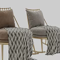 Cozy Rocking Accent Chair With Gold Metal Frame Gray Cushion And Patterned Blanket