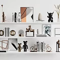 Modern Home Decor Ornament Collection With Sculptures Vase Frames Books And Plants On Shelf
