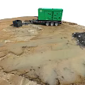 Green Generator Trailer On Muddy Ground With Black Container And Machinery