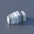 Neatly Stacked White And Gray Books On Gray Background Surface