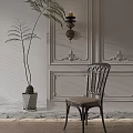 Elegant Wooden Dining Chair With Brown Cushion By Ornate Paneled Wall And Potted Plant