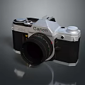 Vintage Canon SLR Camera With Silver Black Body And Classic Lens