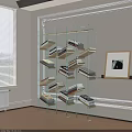 Modern Glass Bookshelf with Multiple Shelves Holding Books Near Window and Framed