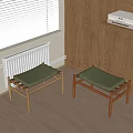 Two Wooden Frame Stools With Gray Padded Seats In Cozy Indoor Corner