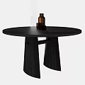 Round Black Dining Table With Unique Base Design And Decorative Brown Bottle Cups 3d model