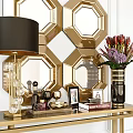 Gold Console Table With Black Lampshade Lamp Flower Vase Photo Frames And Geometric Mirror Wall
