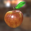 Vibrant red and yellow apple with green leaf on light gray background