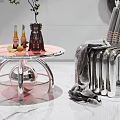 Modern Chrome Single Chair With Woven Seat And Pink Round Coffee Table With Green Plant