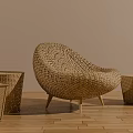 Wicker Leisure Chair With Matching Side Tables On Wooden Floor And Neutral Wall