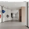 Long Minimalist Office Hallway With White Walls Wooden Partitions And Hanging Colorful Stone Decorations