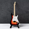 Electric Guitar With Sunburst Finish Wooden Neck And White Pickguard On Dark Background
