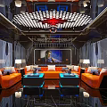 Modern KTV Lounge Interior With Orange Sofas Illuminated Coffee Tables And Large Screen TV
