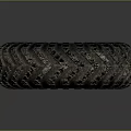 Worn Off-Road Tire With Deep Tread Pattern And Green Rim Design Details