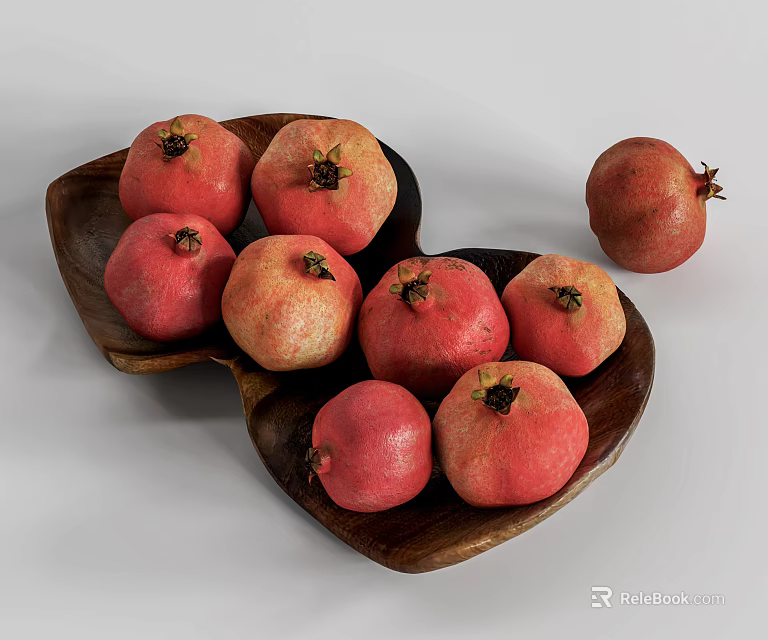 Fresh Ripe Pomegranates In Heart Shaped Wooden Bowl And One Extra On White Background 3d model 