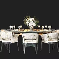 Elegant Dining Table Set with Patterned Chairs White Floral Centerpiece and Wine Glasses