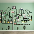 Tree Shaped Photo Wall With Family Photos On Green Wall And Big Family Text