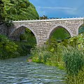 Stone Arch Bridge Surrounded by Green Mountains and River with Trees and Vegetation