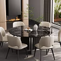 Modern Restaurant Interior With Round Black Marble Dining Table White Chairs Vase Plant And Fireplace