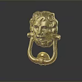 Brass Metal Door Knocker With Intricate Carved Human Face Design On Dark Background