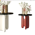 Metallic Vase With White Pink Flowers On Black Round Side Tables Red White Legs