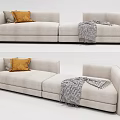 Modern Beige Two Seater Sofa With Decorative Pillows And Throw Blanket 3d model