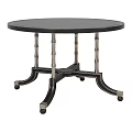 Round Black Dining Table With Bamboo Style Legs Metal Accents and Wheels For Mobility
