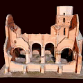 Ancient Red Brick Ruined Building With Arched Doorways Circular Window And Tower Structure