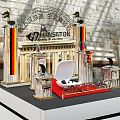 Hansaton Display Shelves Exhibition Booth Design With Since 1956 Signage And Red Carpet
