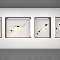 Modern Wall Lamps Displayed in White Cases with Various Designs and Lighting Effects