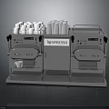 Silver Nespresso Coffee Machine With Stainless Steel Design And Coffee Cups On Top