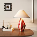 Red White Striped Table Lamp With Beige Lampshade On Wooden Table With Books And Cup