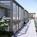 Modern Outdoor Glass Corridor With Landscaped Plants And Paved Walkway