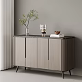 Modern Grey Entryway Cabinet Sideboard With Potted Plant Figurine Bowl And Books On Top