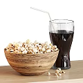 Crispy Popcorn in Wooden Bowl with Refreshing Cola and Straw on Table