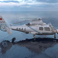 White Civilian Helicopter With Rotors Clear Windows Over Calm Water Surface
