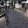 Commercial Landscape With Pedestrian Walkway Stone Pavement Trees White Buildings And Outdoor Seating