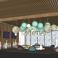 Modern Lounge Area With Pastel Spherical Pendant Lights Large Windows And People Relaxing