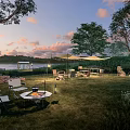 Scenic Lakeside Camping Site With Green Lawn Bonfire Tents And Sunset Views